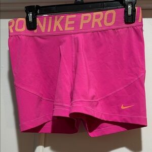 Nike Pro Women's Bright Pink Athletic Shorts with Orange Swoosh